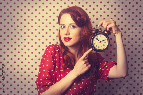 redhead girl with alarm clock