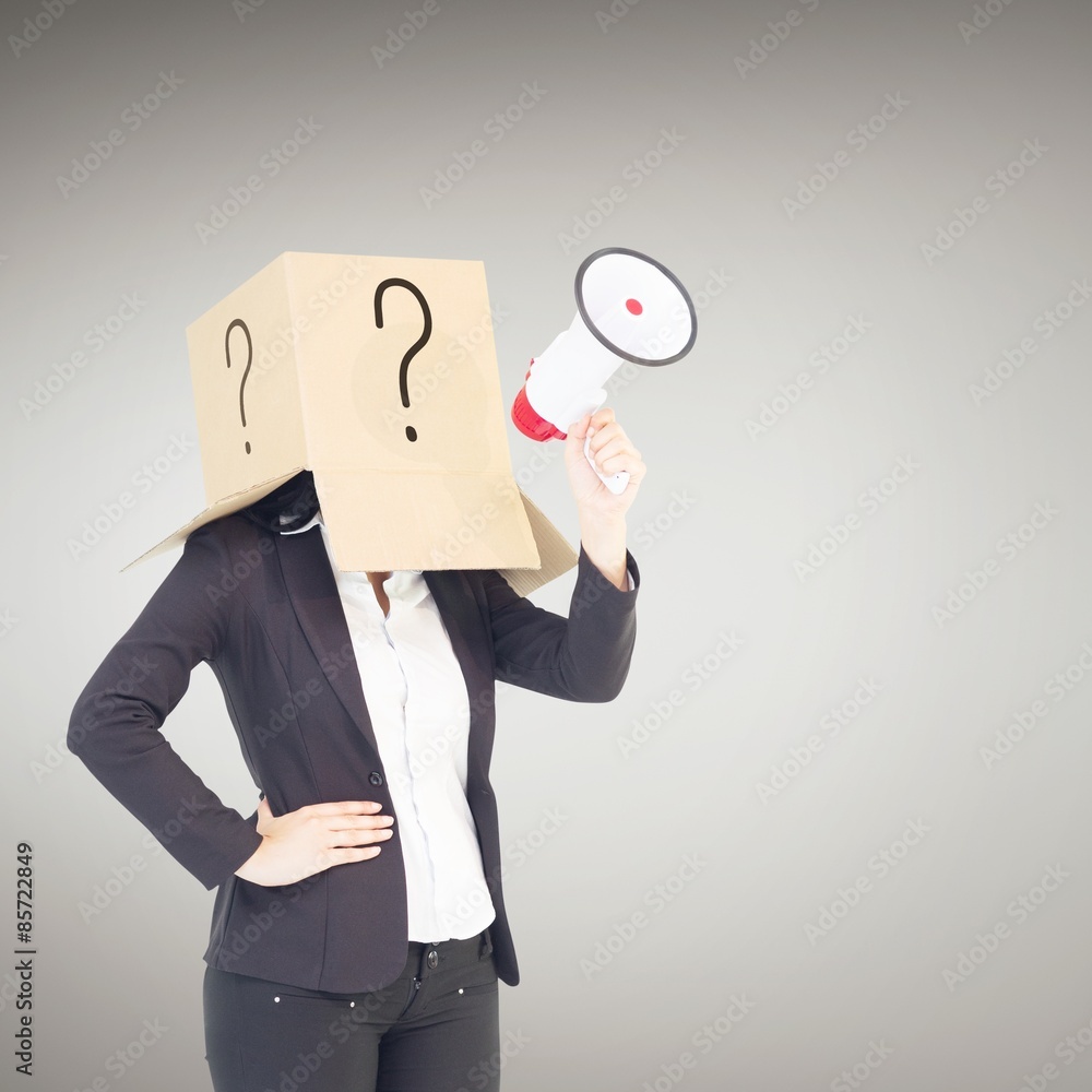 Composite image of anonymous businesswoman holding a megaphone