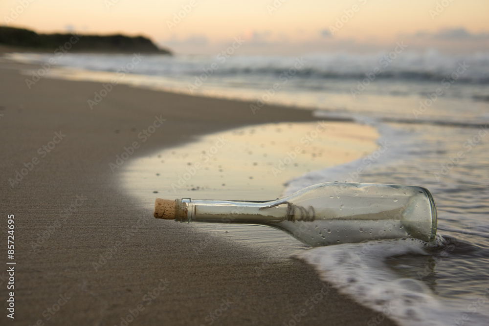 Letter in the bottle, Sunrise over the Sea in the background Letter in the bottle, Sunrise over the Sea in the background