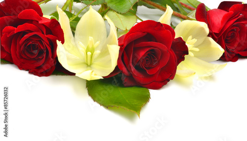 Red roses and yellow flowers isolated on white background