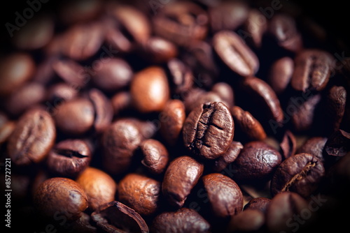 coffee beans on wooden table on brown background