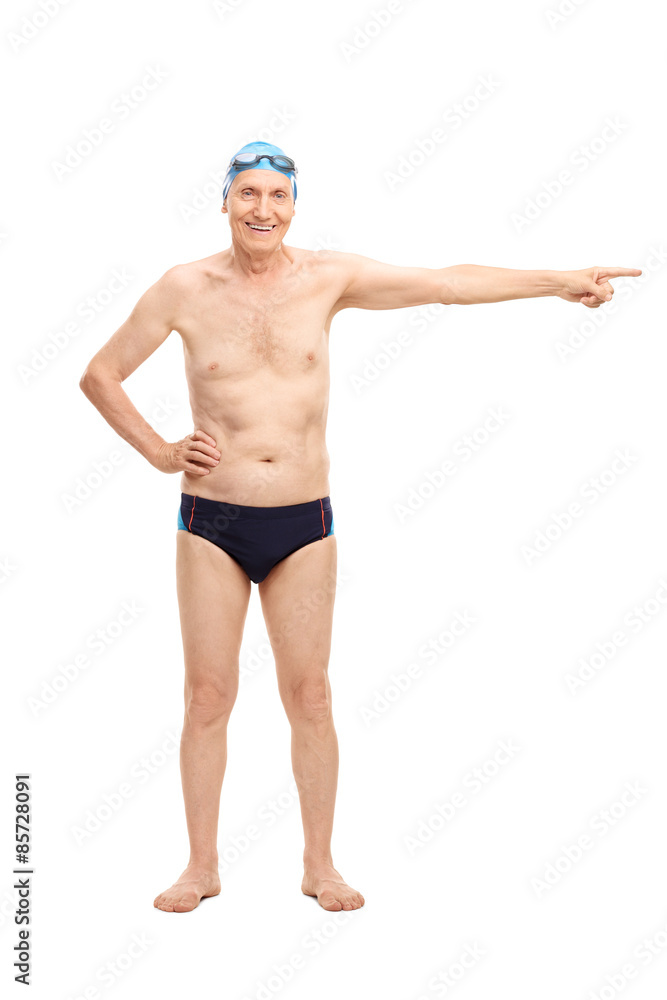 Senior man in swim trunks pointing with his hand Senior man in swim trunks pointing with his hand