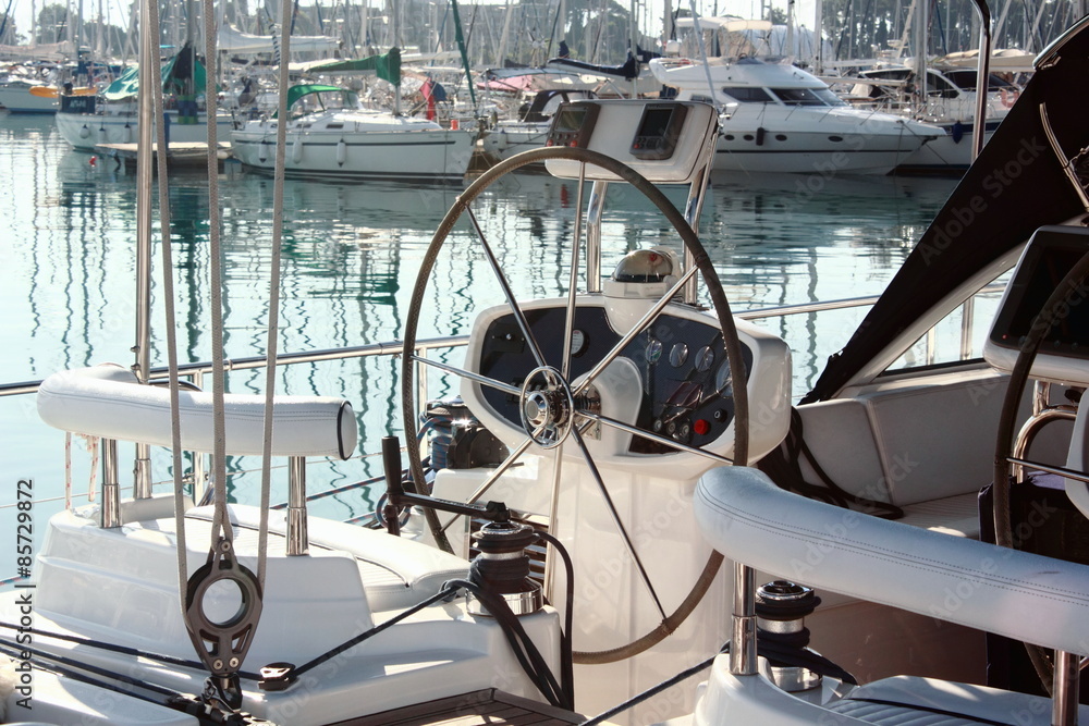 Naklejka premium sail boat yacht cockpit and steering wheel