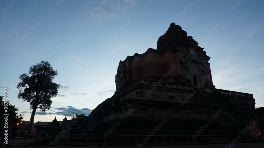 CHIANG MAI, THAILAND - june 16 2014: Tourists visit Wat Chedi Luang temple. Wat Chedi Luang is a Buddhist temple in the historic centre of Chiang Mai, Thailand. Timelapse. CHIANG MAI, THAILAND - june 16 2014: Tourists visit Wat Chedi Luang temple. Wat Chedi Luang is a Buddhist temple in the historic centre of Chiang Mai, Thailand. Timelapse.