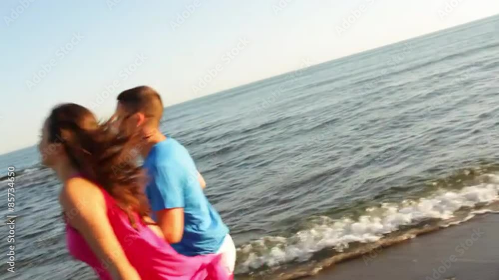 Young couple running on beach Young couple running on beach