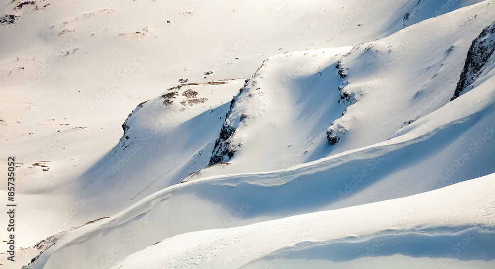 snowy mountain peaks against the blue sky snowy mountain peaks against the blue sky