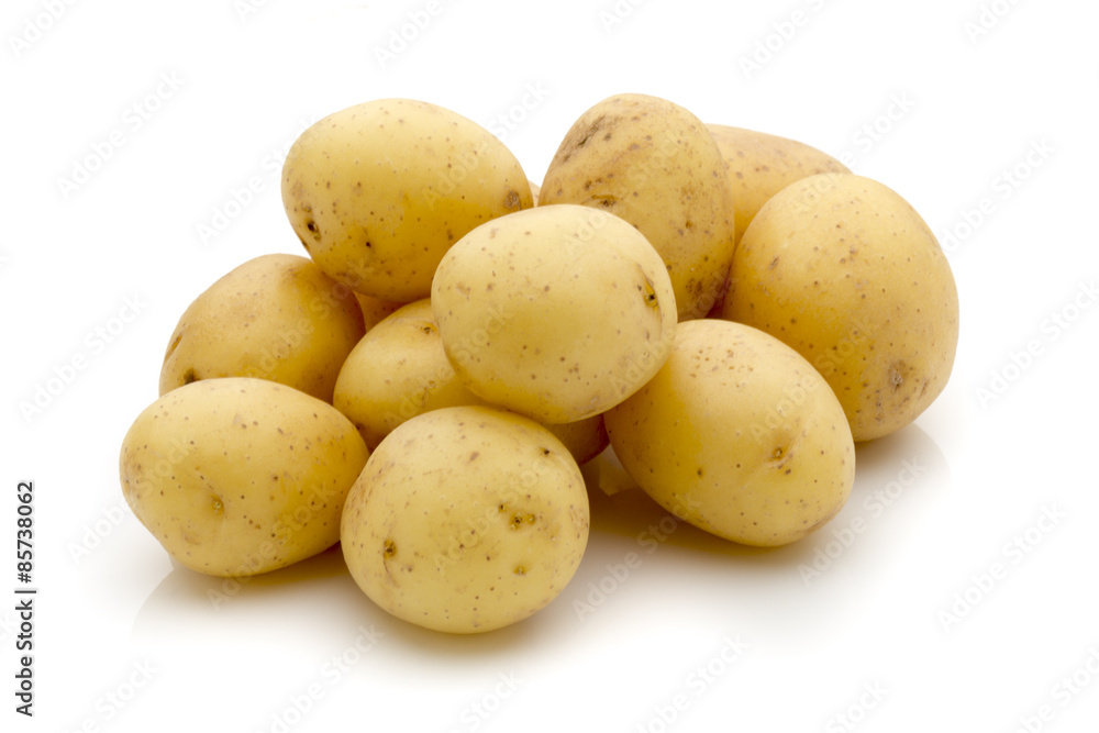 Potatoes on the white background. New harvest. Potatoes on the white background. New harvest.