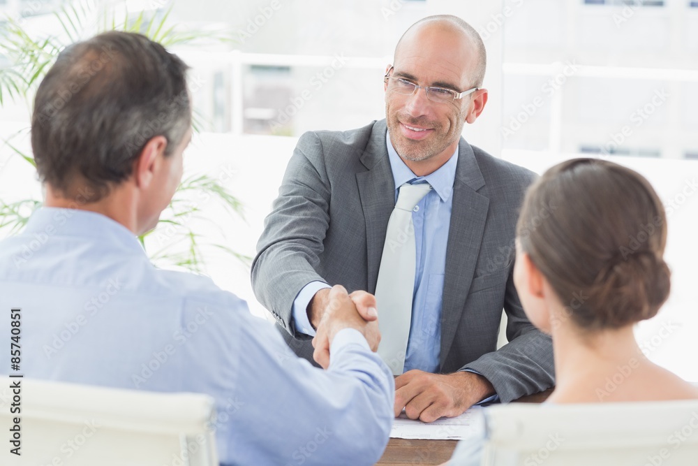 Businessman shaking hands with a co worker Businessman shaking hands with a co worker