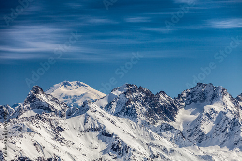 Snowy peaks against the blue sky