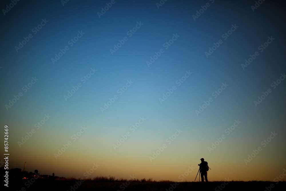 Silhouette of a photographer during the sunset.