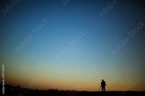 Silhouette of a photographer during the sunset.