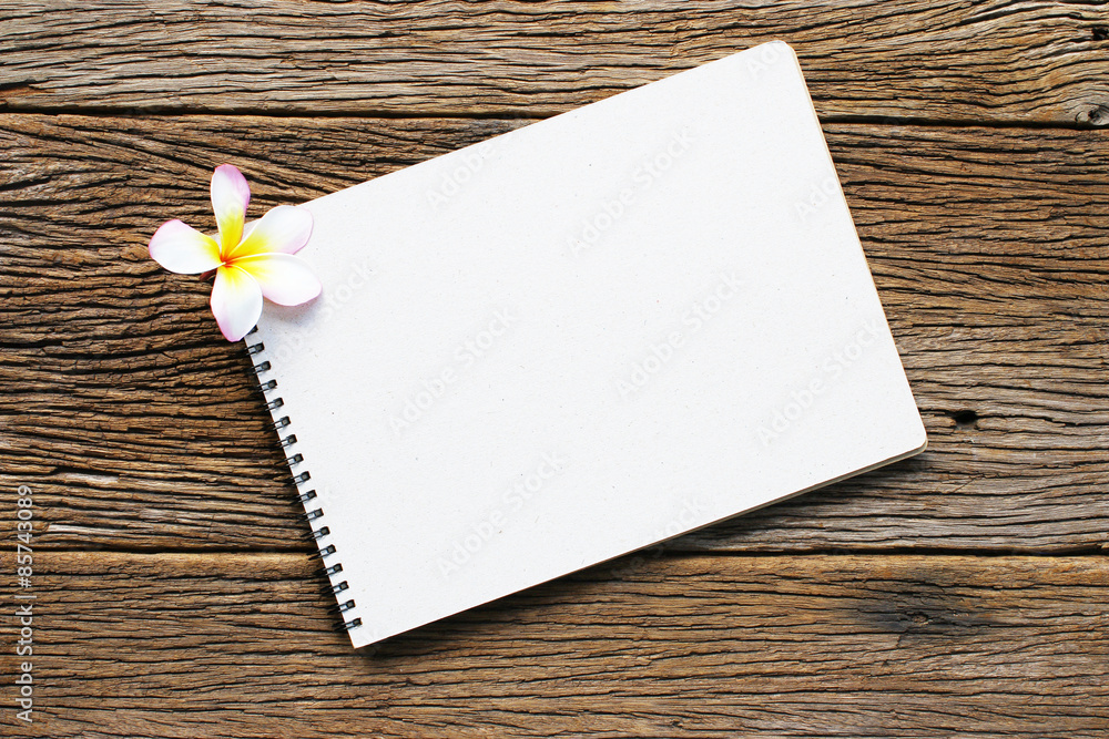 Notebook on wooden table Notebook on wooden table