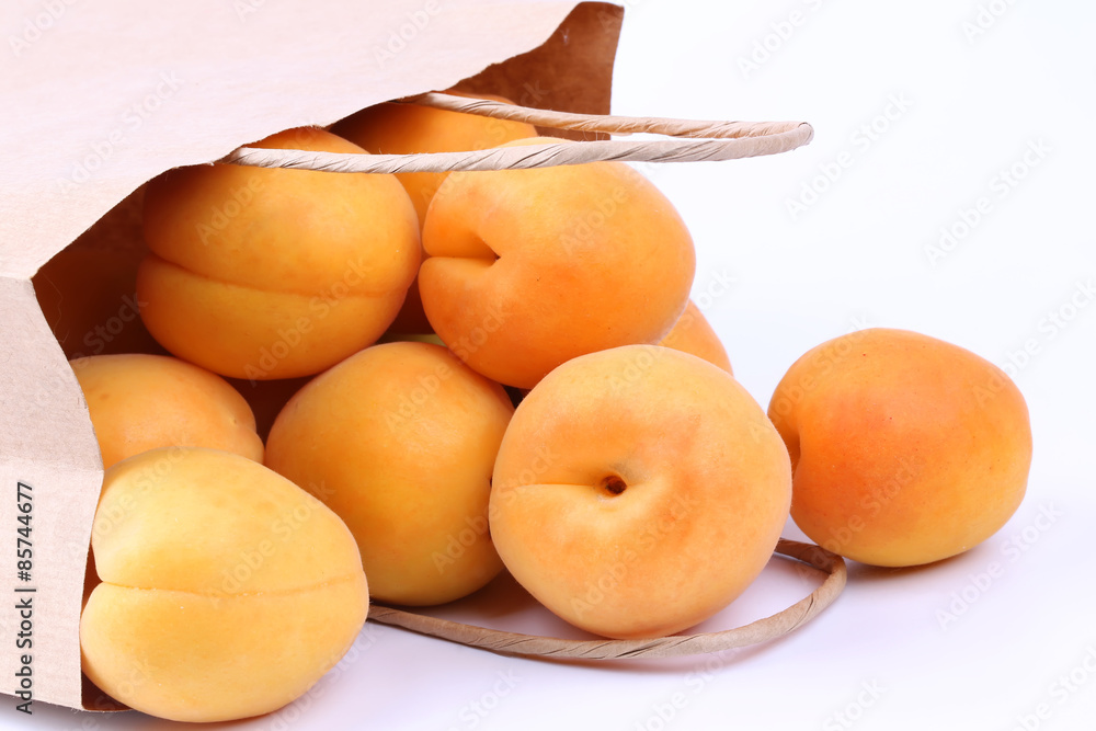 Apricot in a paper shopping bags Apricot in a paper shopping bags