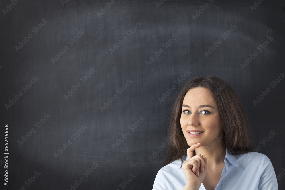 Businesswoman in front of blackboard Businesswoman in front of blackboard