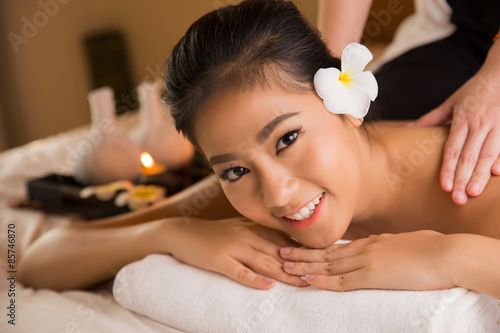 Asian woman having massage and spa salon Beauty treatment concept. She is very happy