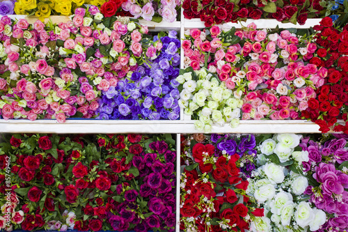 a lot of artificial flowers in the market