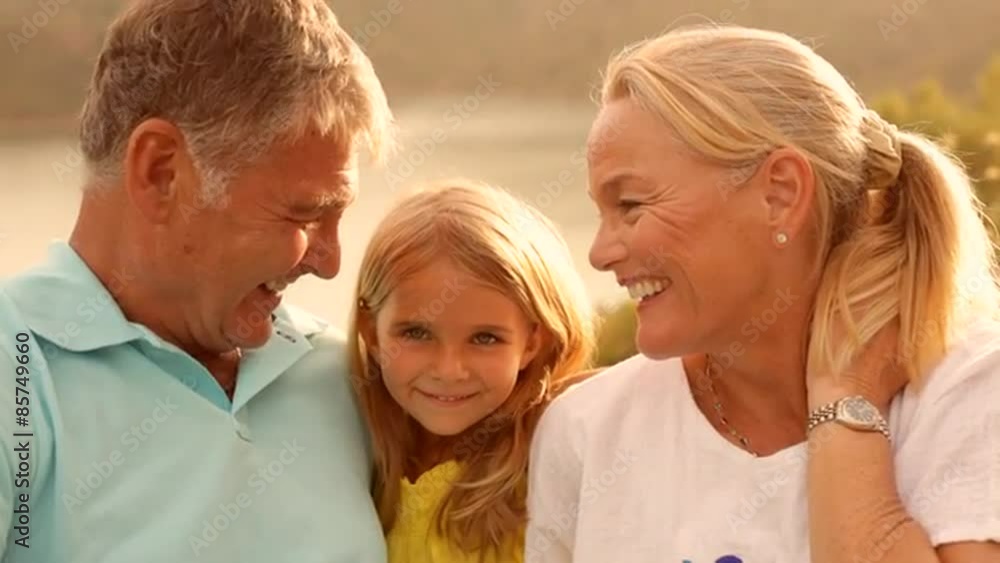 Grandparents and Grandchild in sunset in countryside Grandparents and Grandchild in sunset in countryside