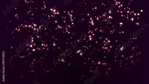 Looped glowing small particles on dark purple background