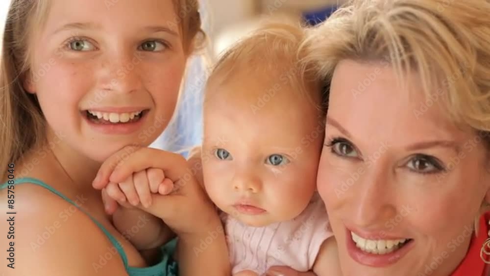 Close up of grandmother and two granddaughters together. Close up of grandmother and two granddaughters together.