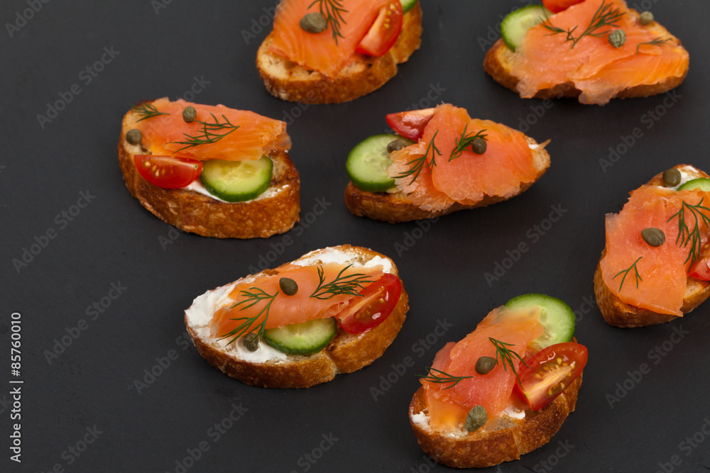 Finger food canapes with smoked salmon and cream cheese. Selective focus. Finger food canapes with smoked salmon and cream cheese. Selective focus.