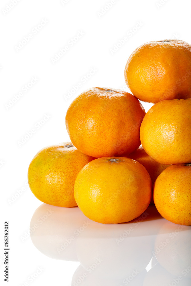 Stack of tropical tangerines, isolated on white with clipping pa Stack of tropical tangerines, isolated on white with clipping pa
