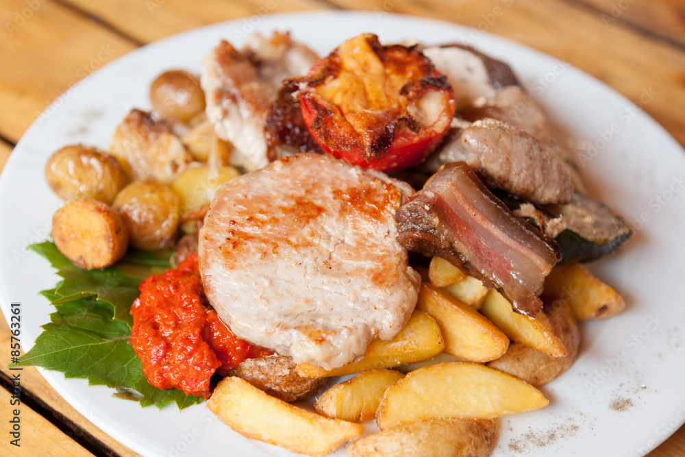 Plate with grilled meat and chicken in local Croatian restaurant