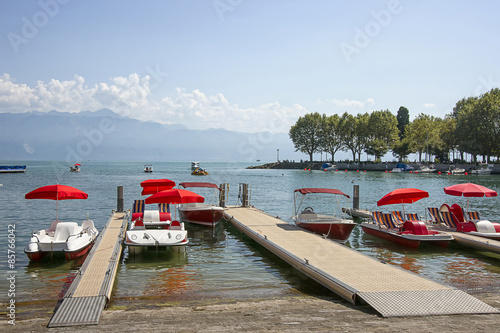 Red catamarans in Geneva lake bay harbor in Lausanne, Switzerlan