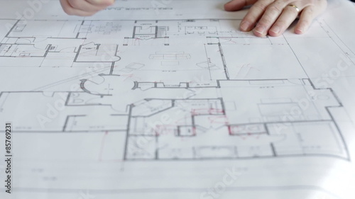 architect makes changes to floor plans