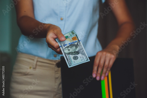 Money in human hands, women giving dollars