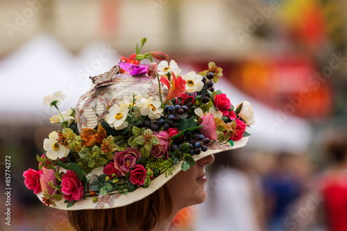 Hat with natural and artificial spring flowers