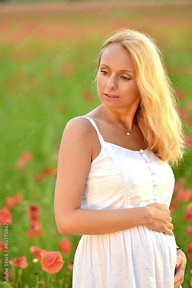 happy pregnant woman in poppie field happy pregnant woman in poppie field