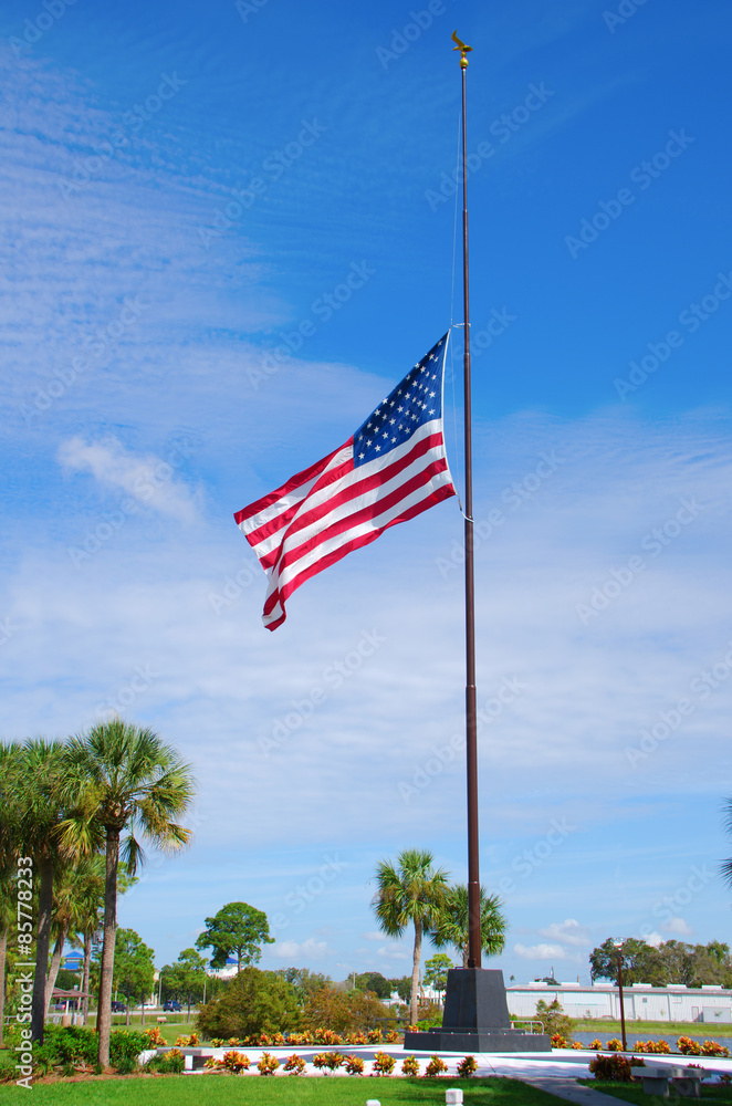 United States of America flag at half staff to commemorate the victims of the Twin Towers attack on September 11, 2001. United States of America flag at half staff to commemorate the victims of the Twin Towers attack on September 11, 2001.