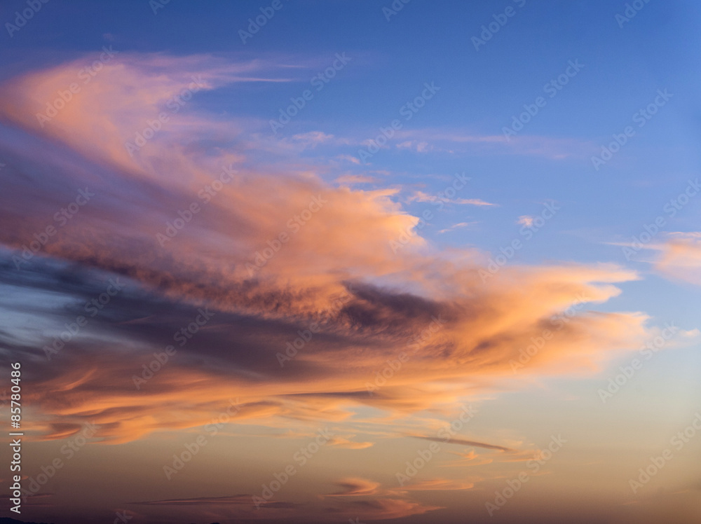sunset with golden and blue sky over the desert