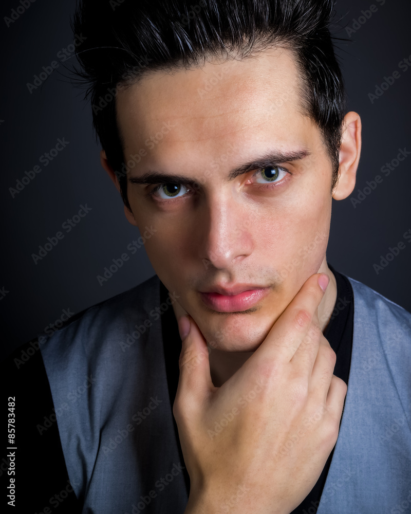 Dark Hair Green Eye Male With Hand On Chin Dark Hair Green Eye Male With Hand On Chin