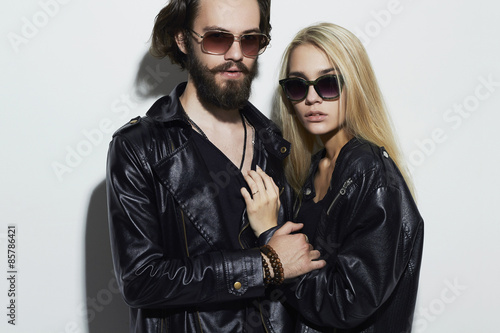 gorgeous fashion beautiful couple.Bearded young man and blonde in sunglasses