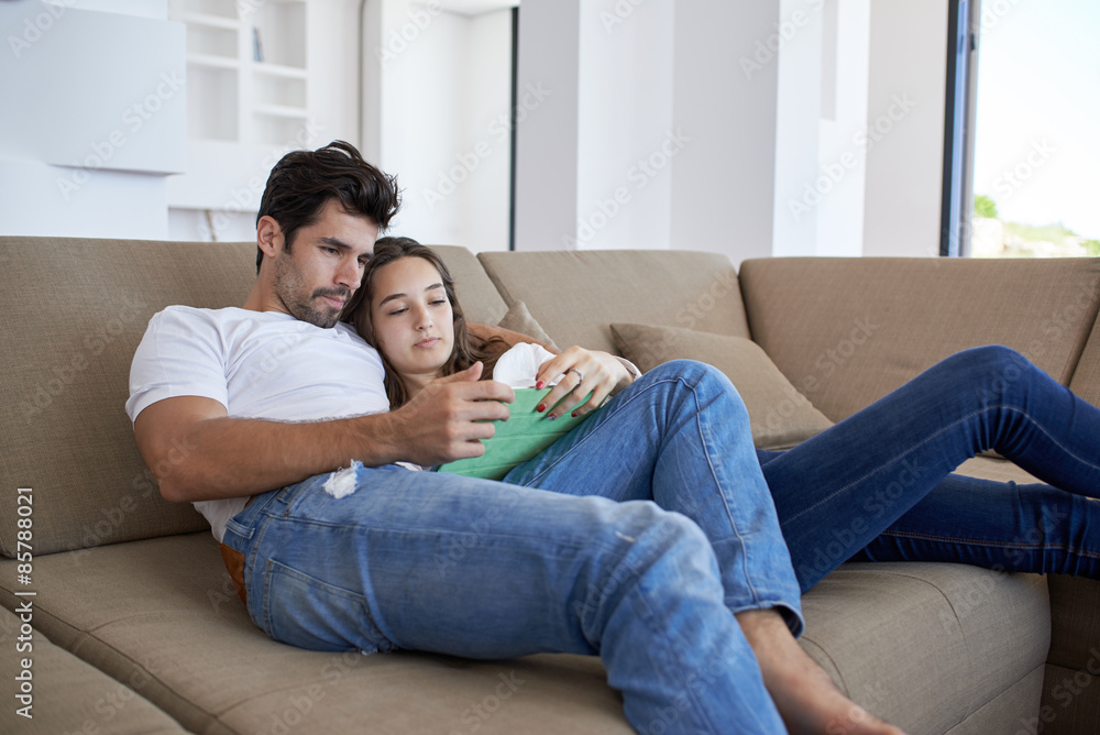 couple at modern home using tablet computer couple at modern home using tablet computer