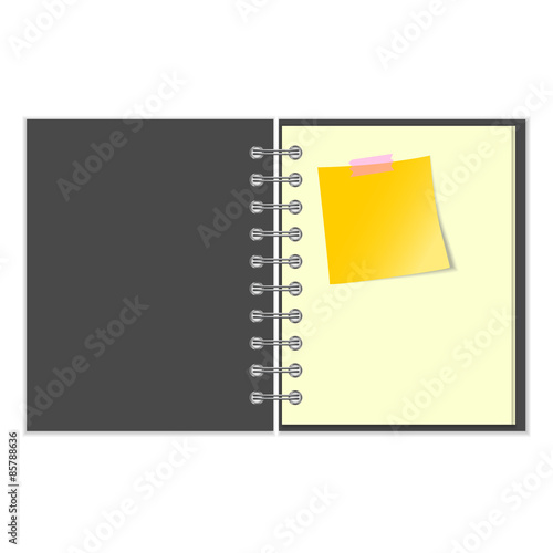 Open grey cover notebook with yellow sticker