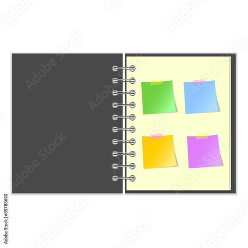 Open grey cover notebook with stickers