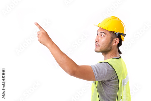 construction worker pointing up at blank space