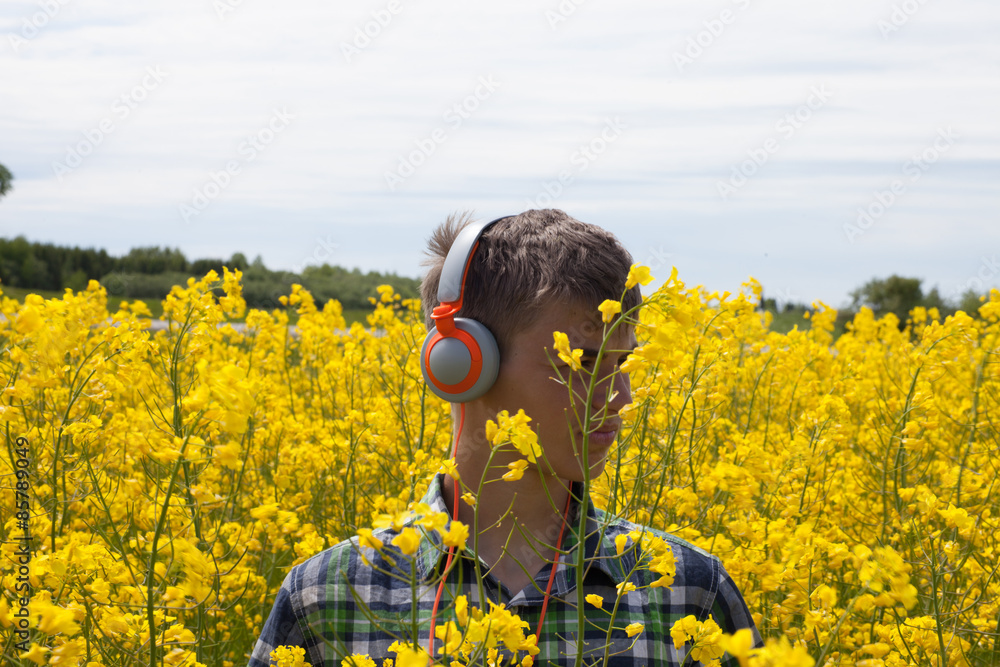 Fototapeta premium Teenager on the rape field