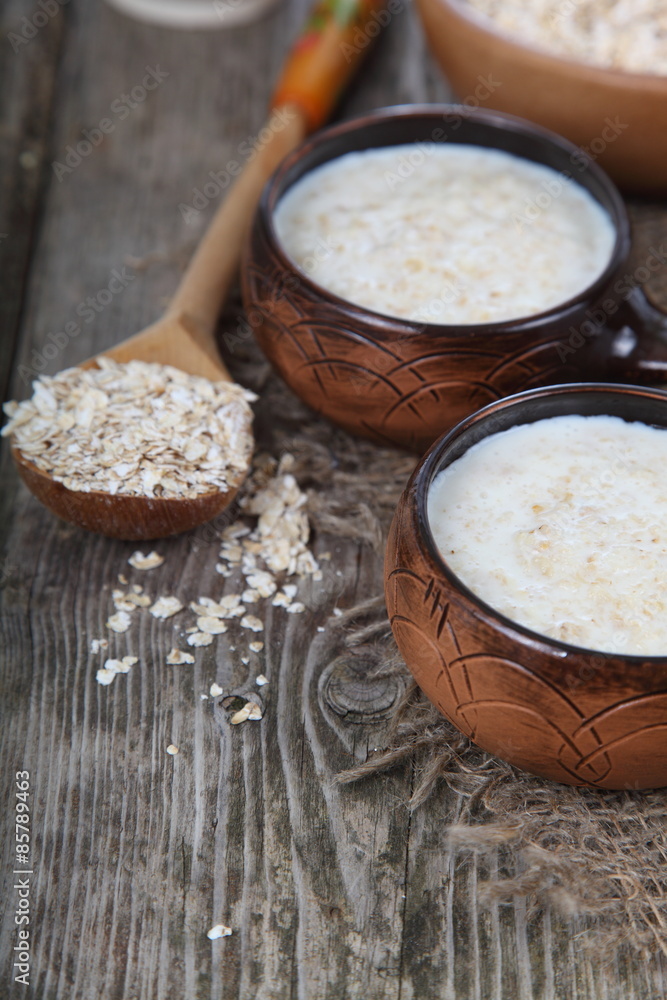 Oatmeal on old wooden table Oatmeal on old wooden table