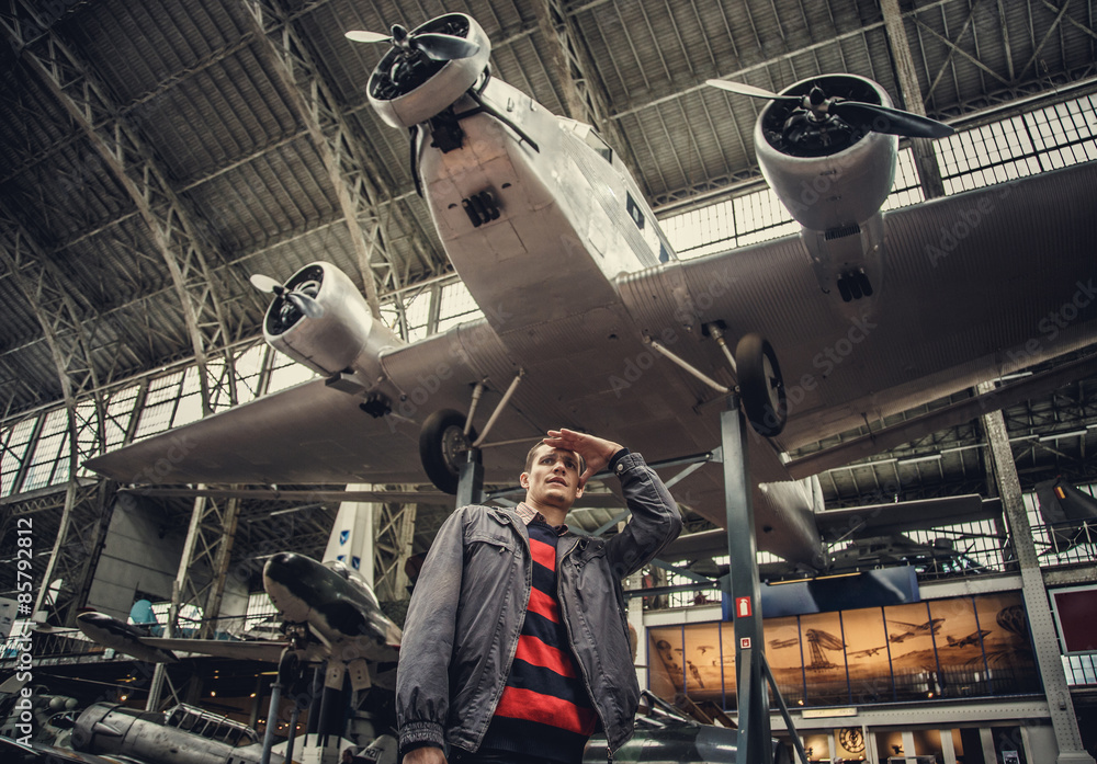 Naklejka premium Man on airplanes exhibition.
