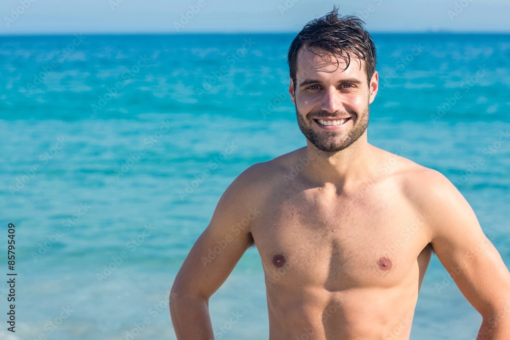 Smiling man at the beach looking at camera Smiling man at the beach looking at camera