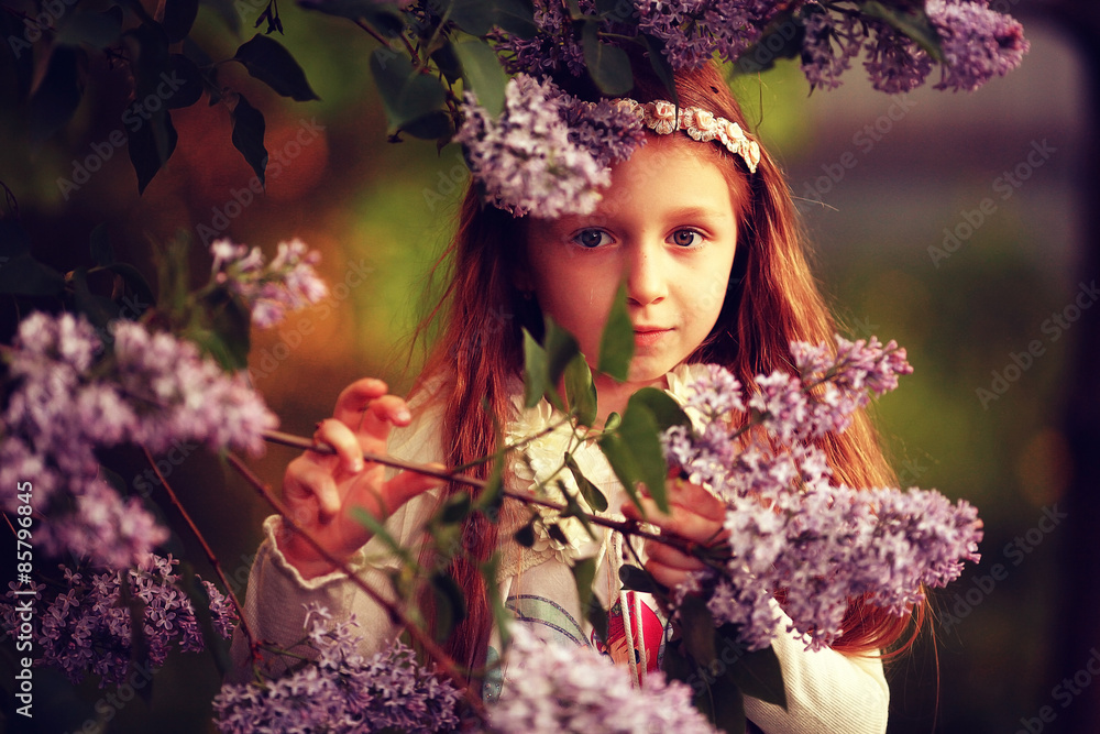 Fototapeta premium girl collects flowers childhood