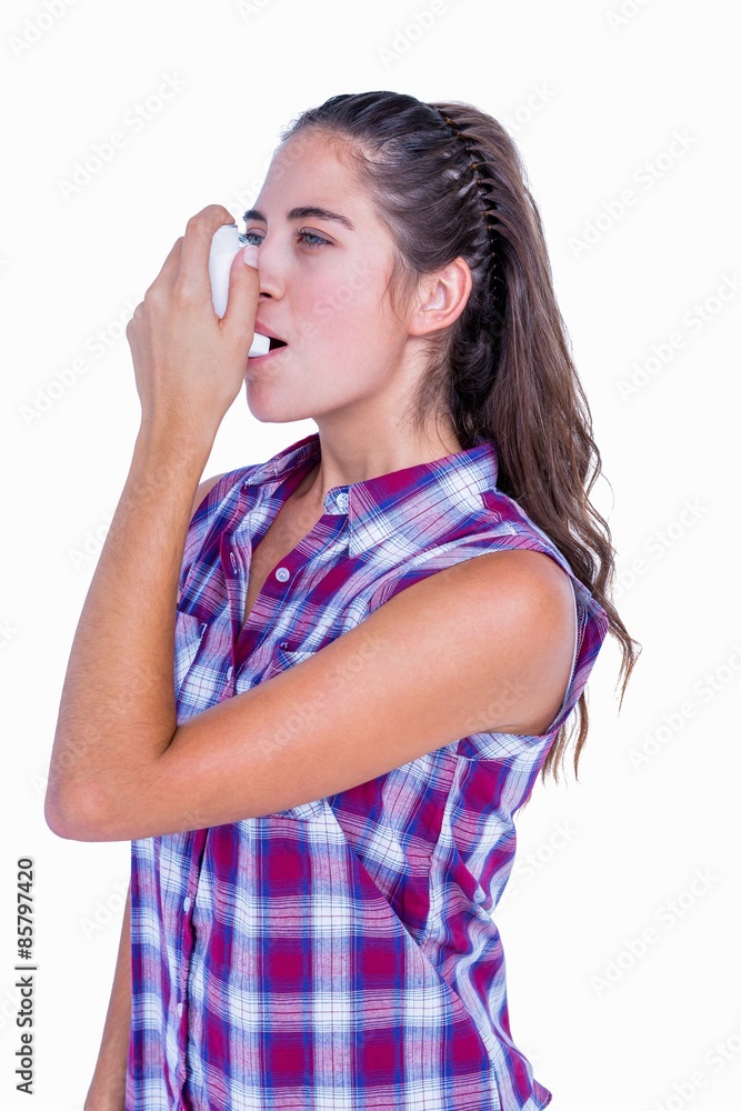 Pretty brunette woman using asthma inhaler Pretty brunette woman using asthma inhaler