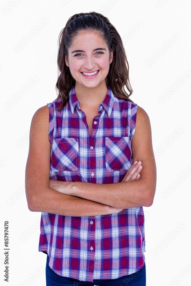 Pretty brunette looking at camera with arms crossed Pretty brunette looking at camera with arms crossed
