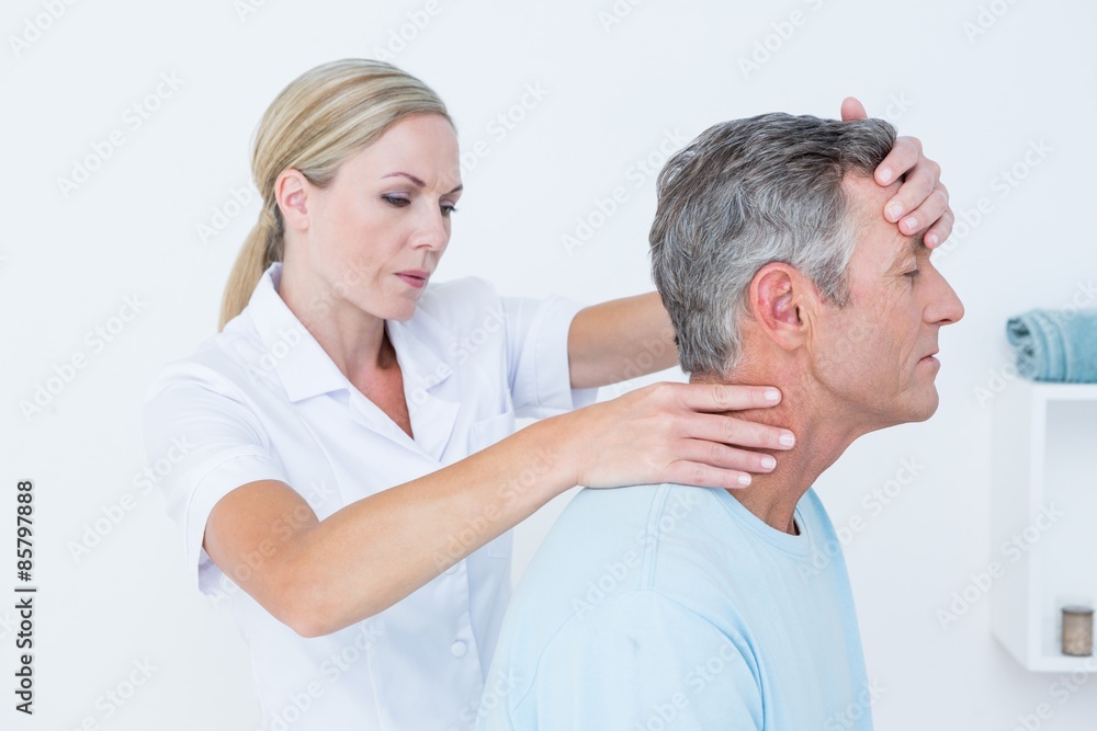 Fototapeta premium Doctor doing neck adjustment