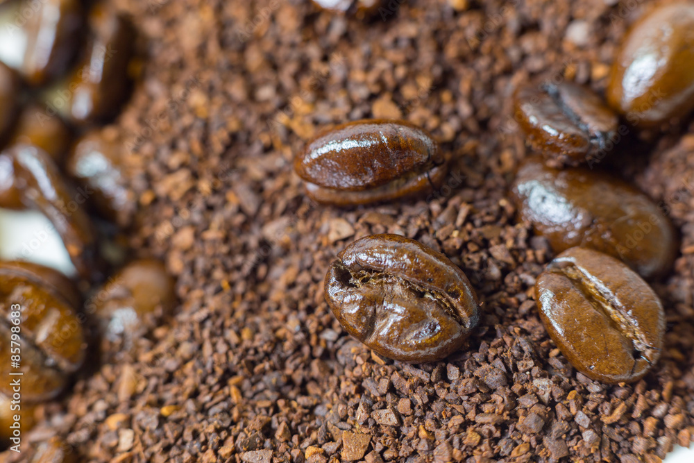 Close up of roasted coffee beans on coffee grounds. Close up of roasted coffee beans on coffee grounds.