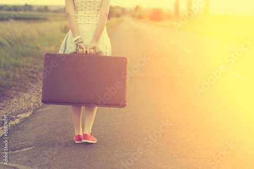 Vintage photo of traveler woman in summer sunset photo