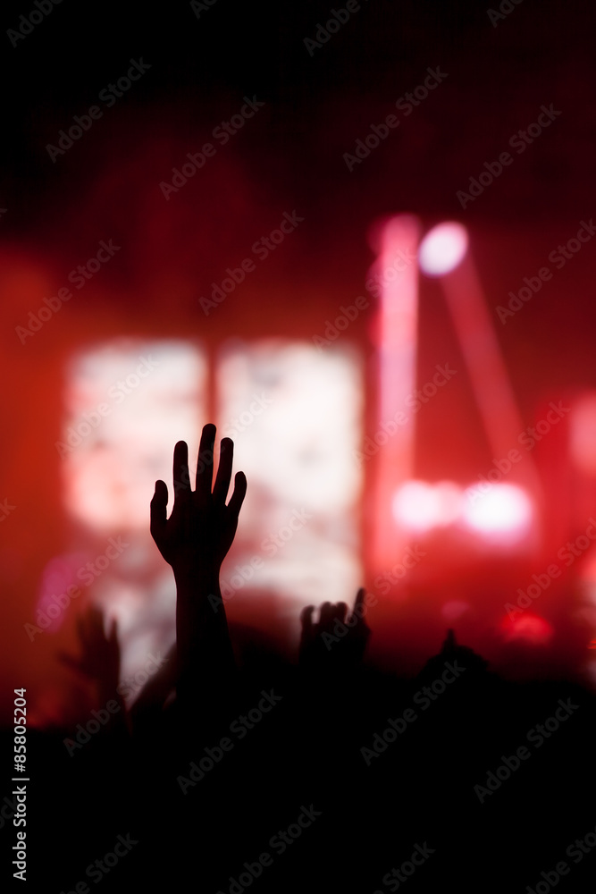 christian music concert with raised hand